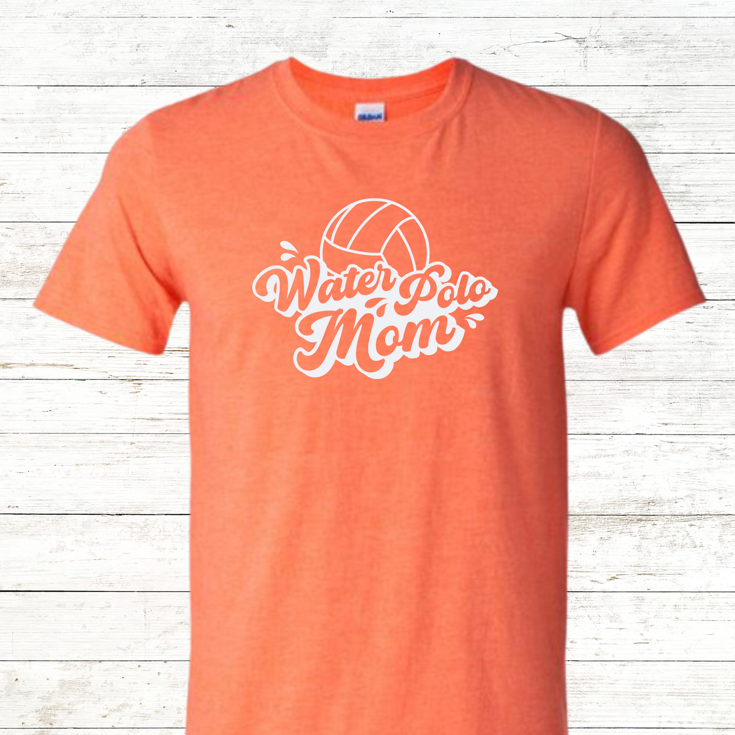 Water Polo Mom T-shirt featuring bold, athletic-style text and a dynamic water polo ball splash graphic. Designed to celebrate proud sports moms who support their athletes with heart and hustle, this shirt is perfect for game days, tournaments, and everyday team spirit.