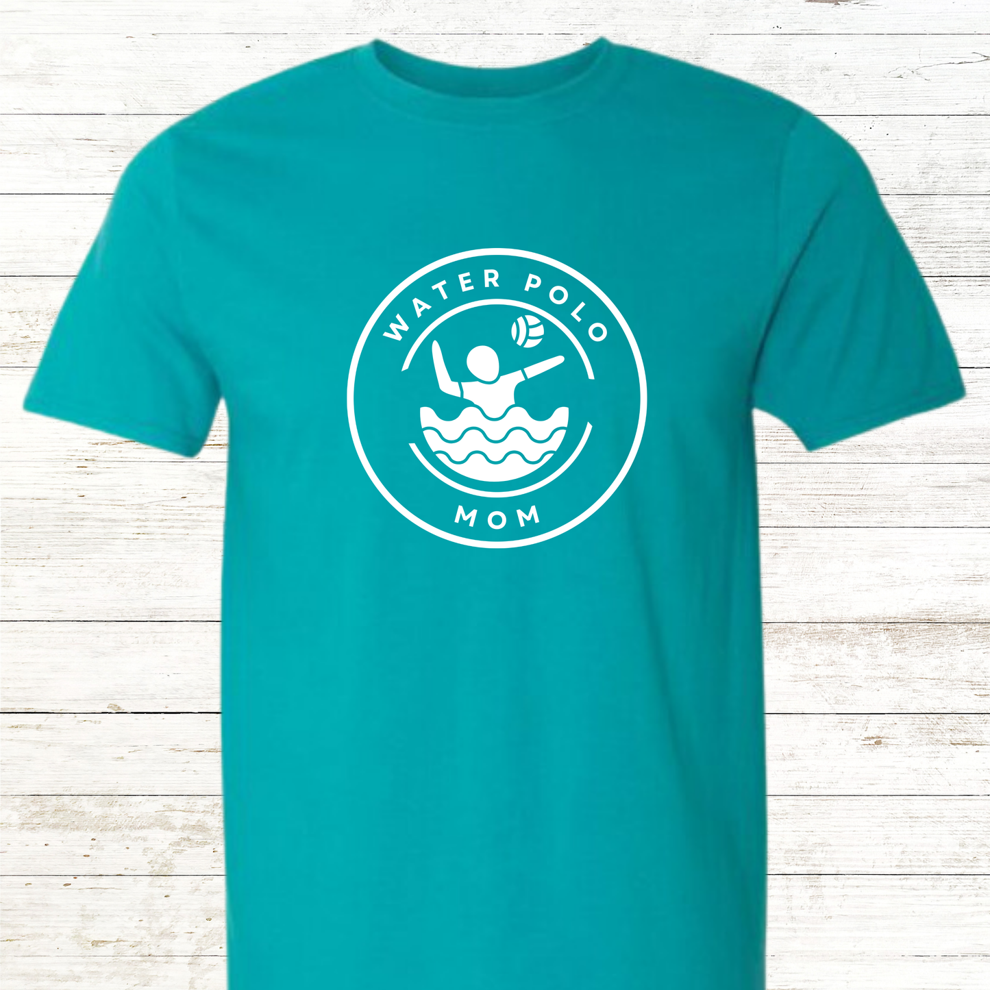 T-shirt design that reads 'Water Polo Mom' in bold, athletic-style lettering, accompanied by a dynamic illustration of a water polo ball splashing into water. The design celebrates the strength, dedication, and pride of moms who support their athletes from the pool deck, capturing the spirited and supportive energy of being a sports parent.