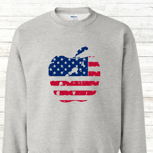 Graphic design of an apple shape filled with the pattern of the American flag—stars in the top left and red and white stripes across the rest. A creative fusion of patriotism and a classic symbol of education or harvest, perfect for teachers, fall designs, or 4th of July celebrations.