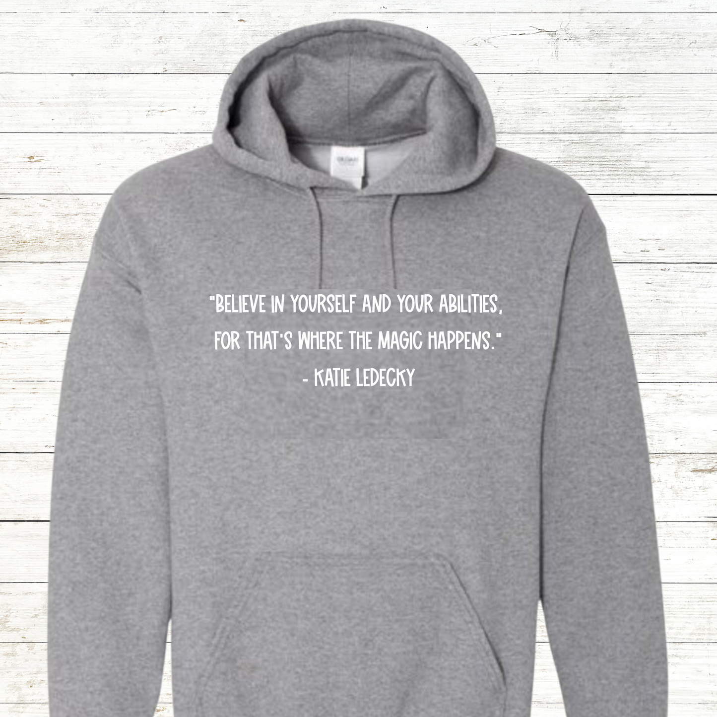 Inspirational swimming shirt or sweatshirt featuring a Katie Ledecky quote. Available in unisex sizes for youth and adults, perfect for swimmers, swim teams, and coaches. A motivational gift for competitive athletes and swim enthusiasts.