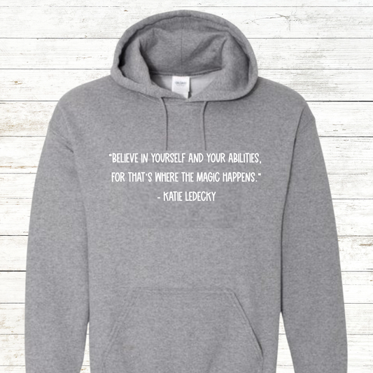 Inspirational swimming shirt or sweatshirt featuring a Katie Ledecky quote. Available in unisex sizes for youth and adults, perfect for swimmers, swim teams, and coaches. A motivational gift for competitive athletes and swim enthusiasts.