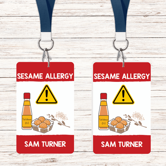 Sesame allergy lunch box tag attached to a lanyard or luggage loop, designed to alert others of a sesame allergy. Durable and easy to attach to lunch boxes, backpacks, or bags for added safety.