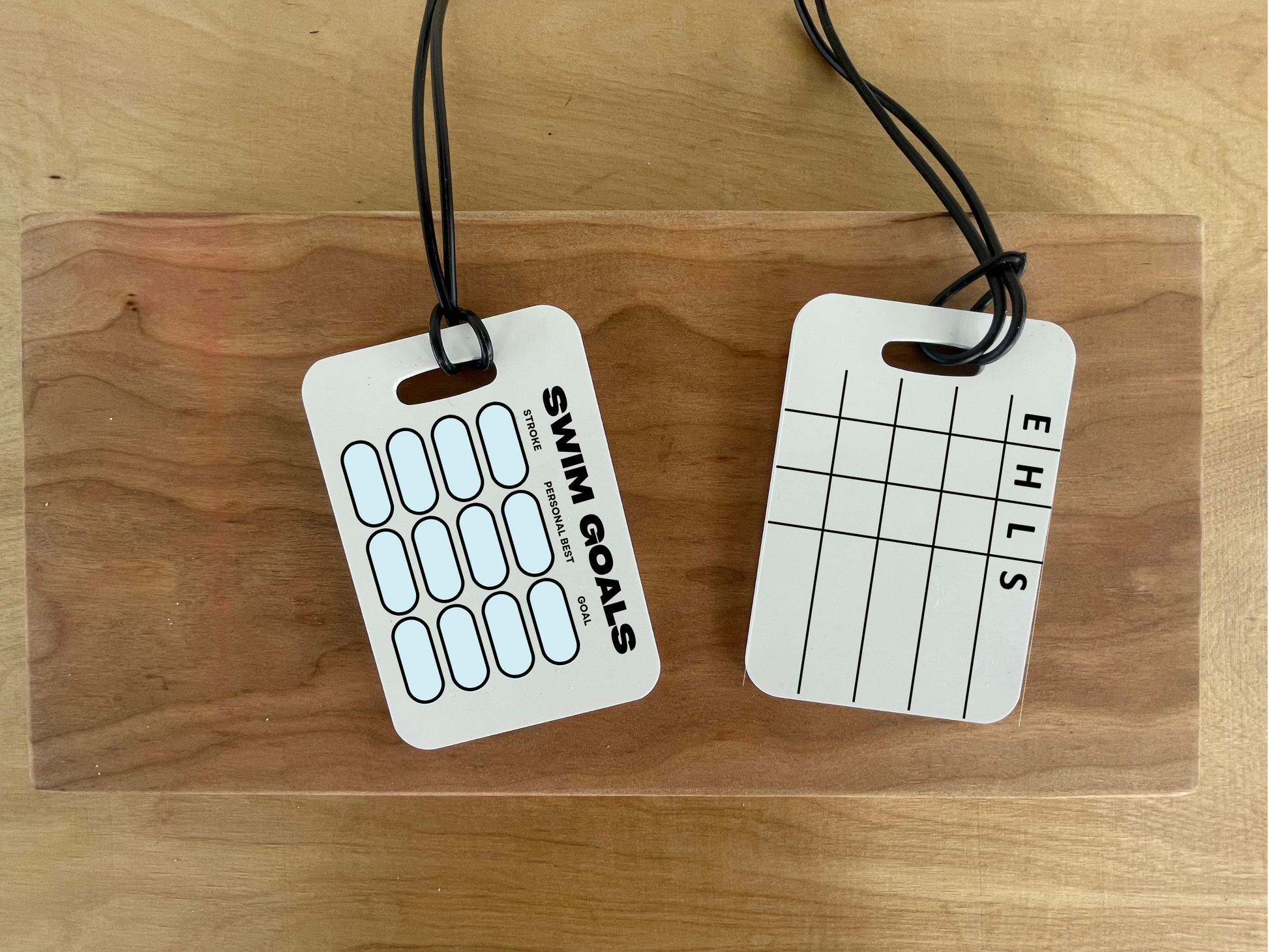 Durable and reusable swim meet heat tag with customizable event, heat, and lane tracking for swimmers and parents.
Waterproof and wipeable swim heat card designed to help swimmers and families stay organized during meets.
Custom swim meet event tracker tag that easily clips onto a bag or lanyard for quick and stress-free access.