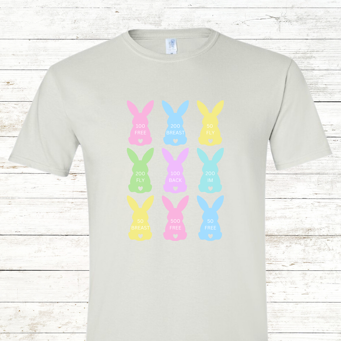 Swim-themed Easter shirt featuring pastel bunny peeps, each showcasing a different swim stroke—freestyle, backstroke, breaststroke, and butterfly. Perfect for swimmers and Easter celebrations!